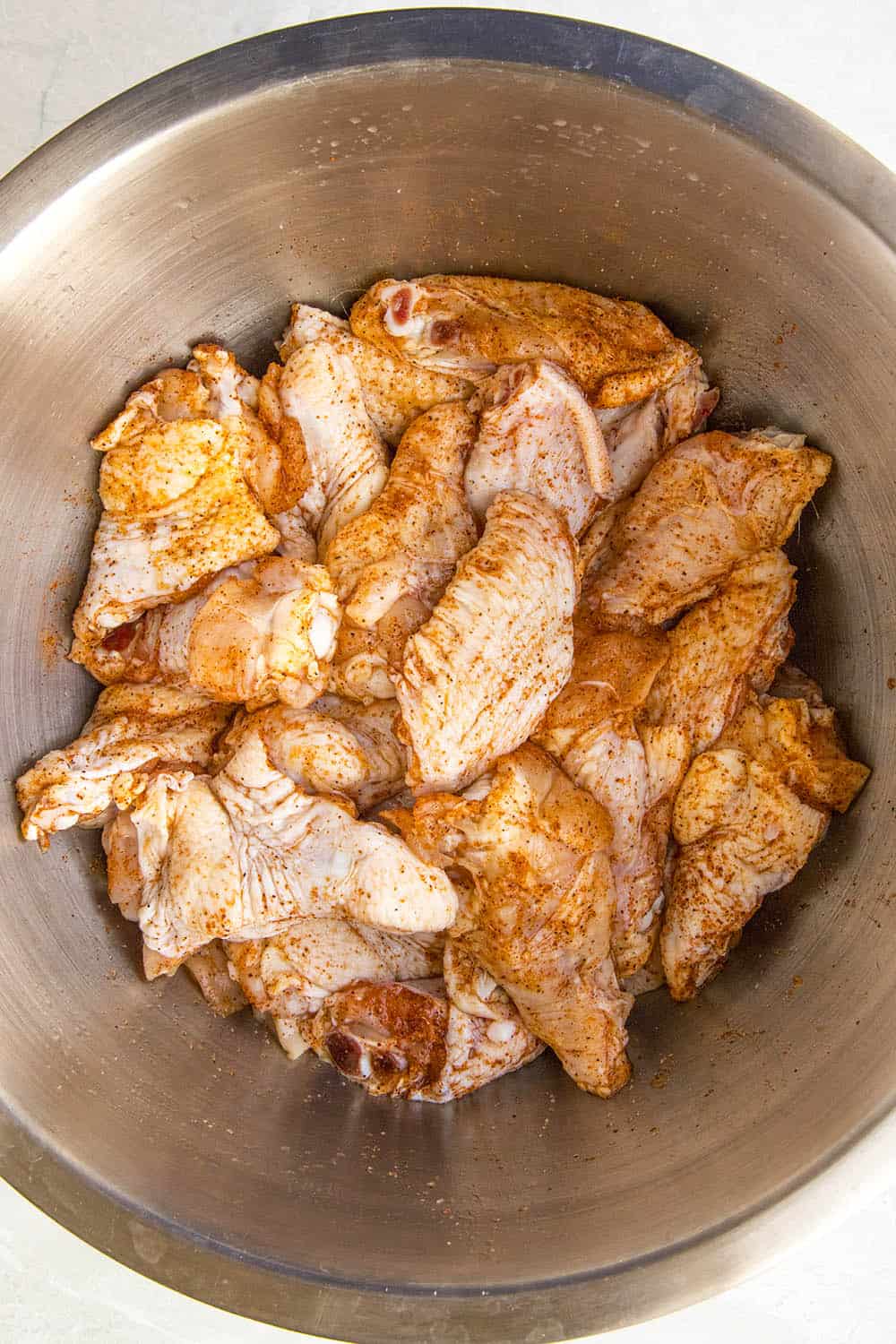 Seasoned chicken wings, ready to cook.