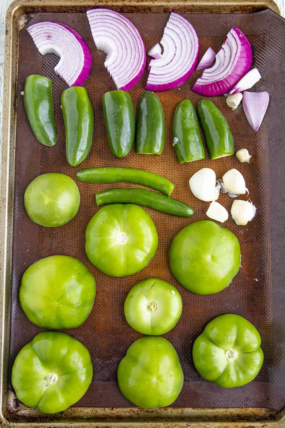Ingredients for tomatillo sauce on a roasting pan, ready to go into the oven