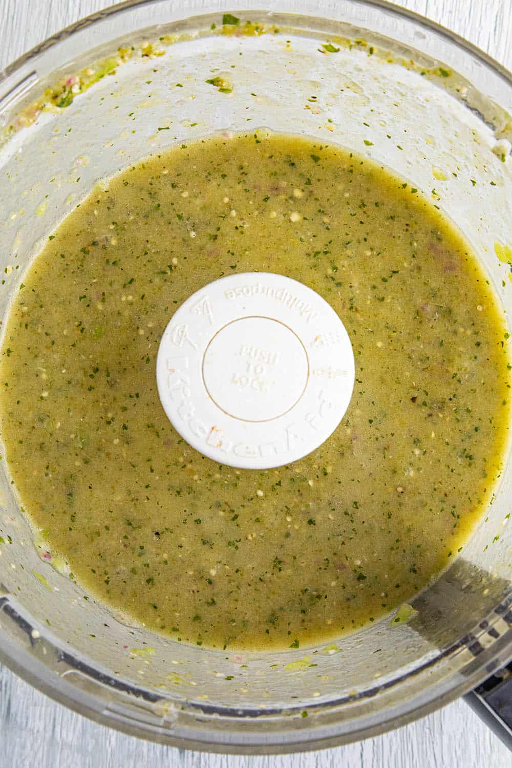Tomatillo sauce, emulsified with oil in a food processor