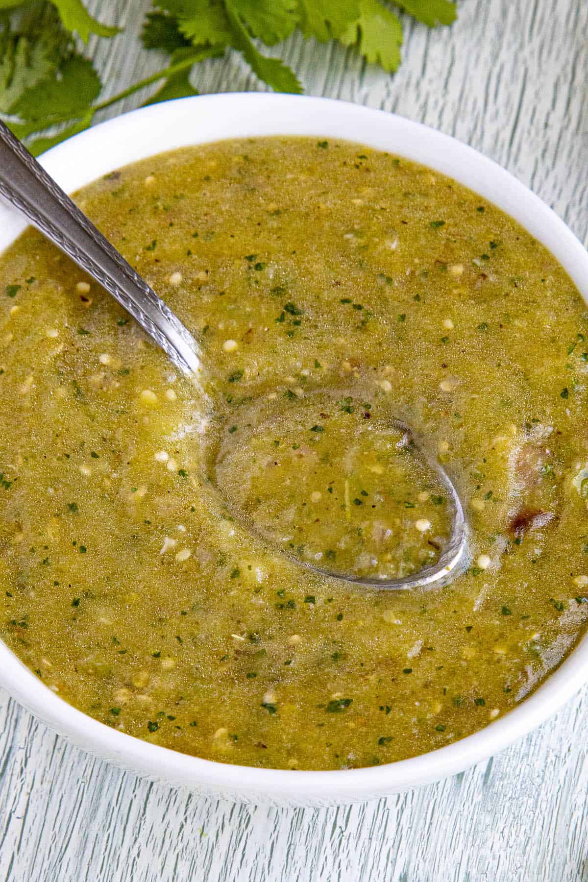 Tomatillo Sauce in a bowl with a spoon