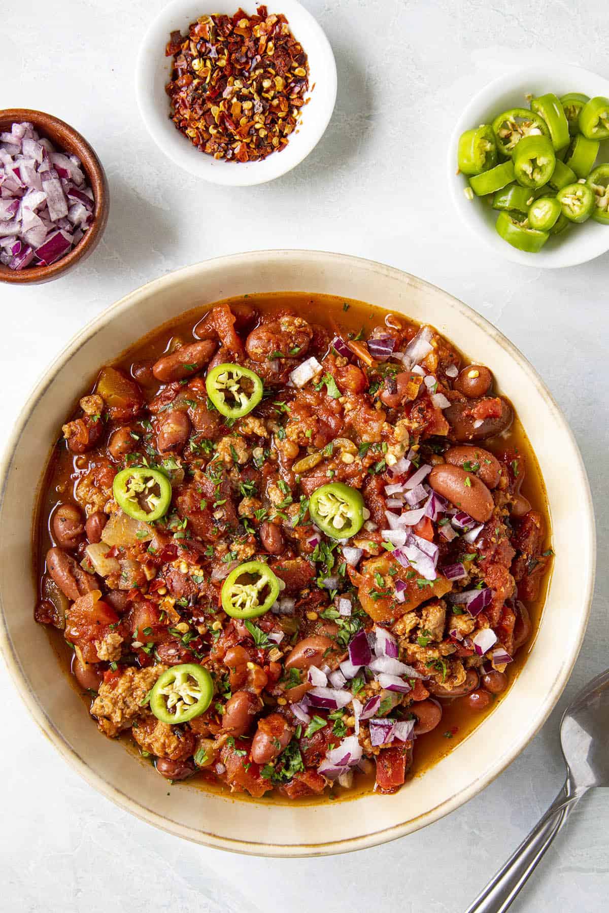 Turkey Chili in a bowl with extra fixings