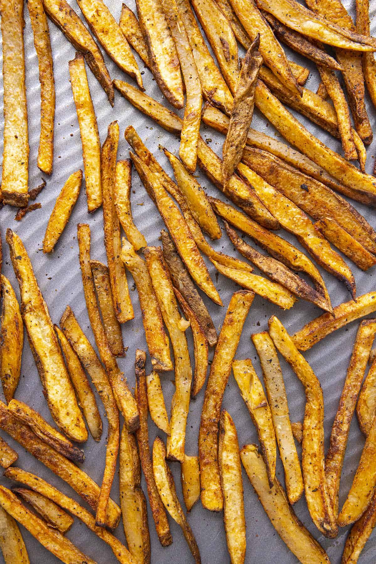 Baked Cajun Fries on a baking sheet