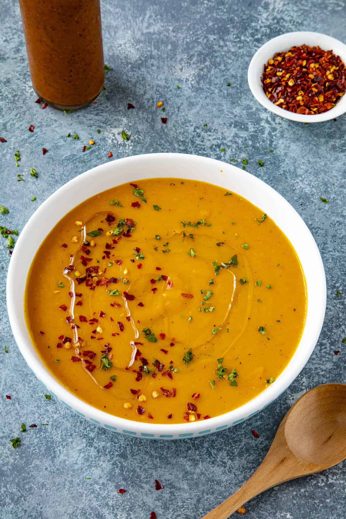 Spicy Cajun-Style Carrot Soup in a bowl with chili flakes