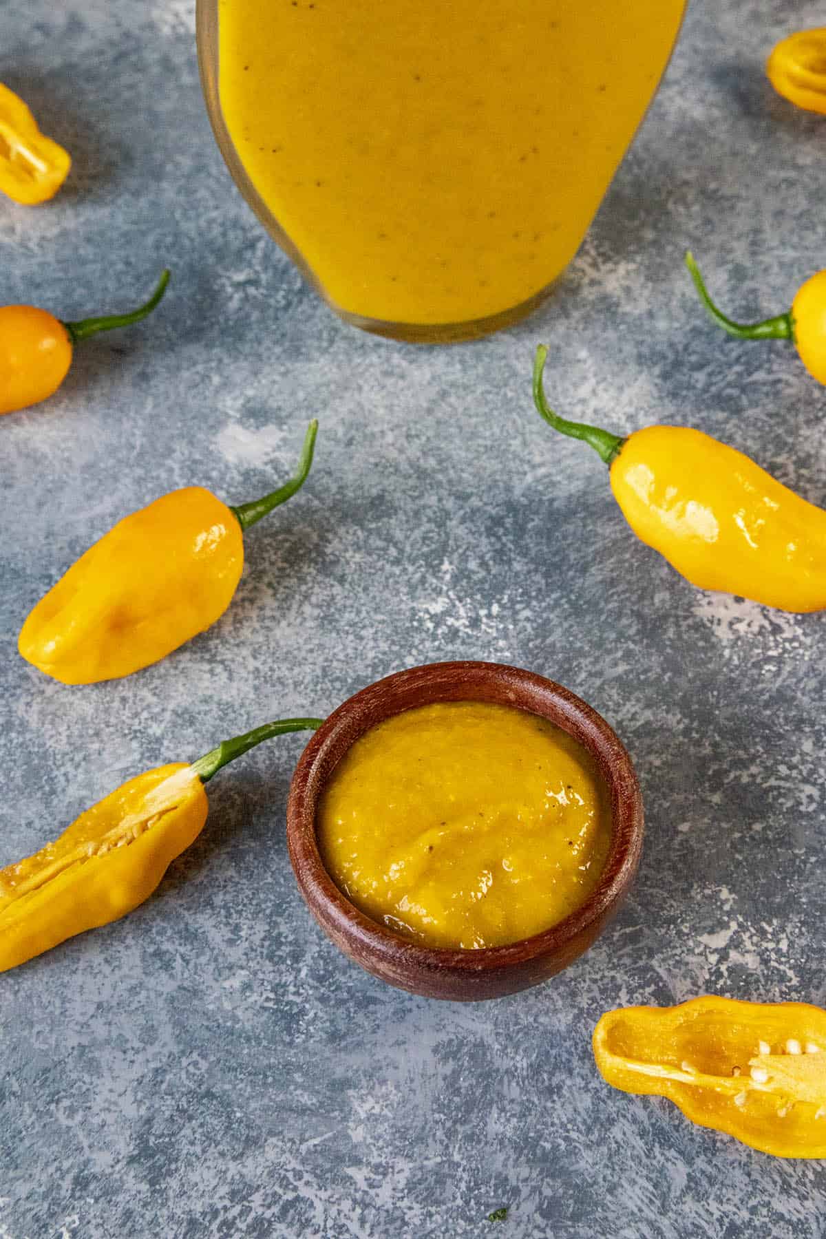 Devils Tongue Hot Sauce in a small bowl, very vibrant yellow in color