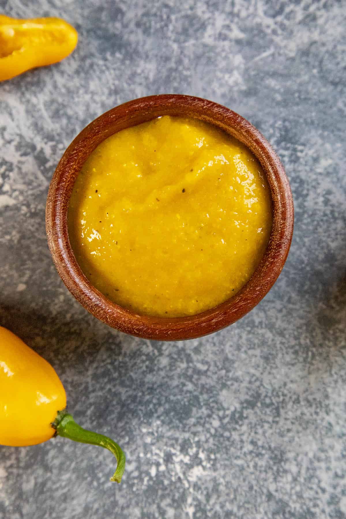 Devils Tongue Hot Sauce in a wooden bowl, ready to serve