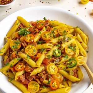 Penne Arrabbiata served in a white bowl