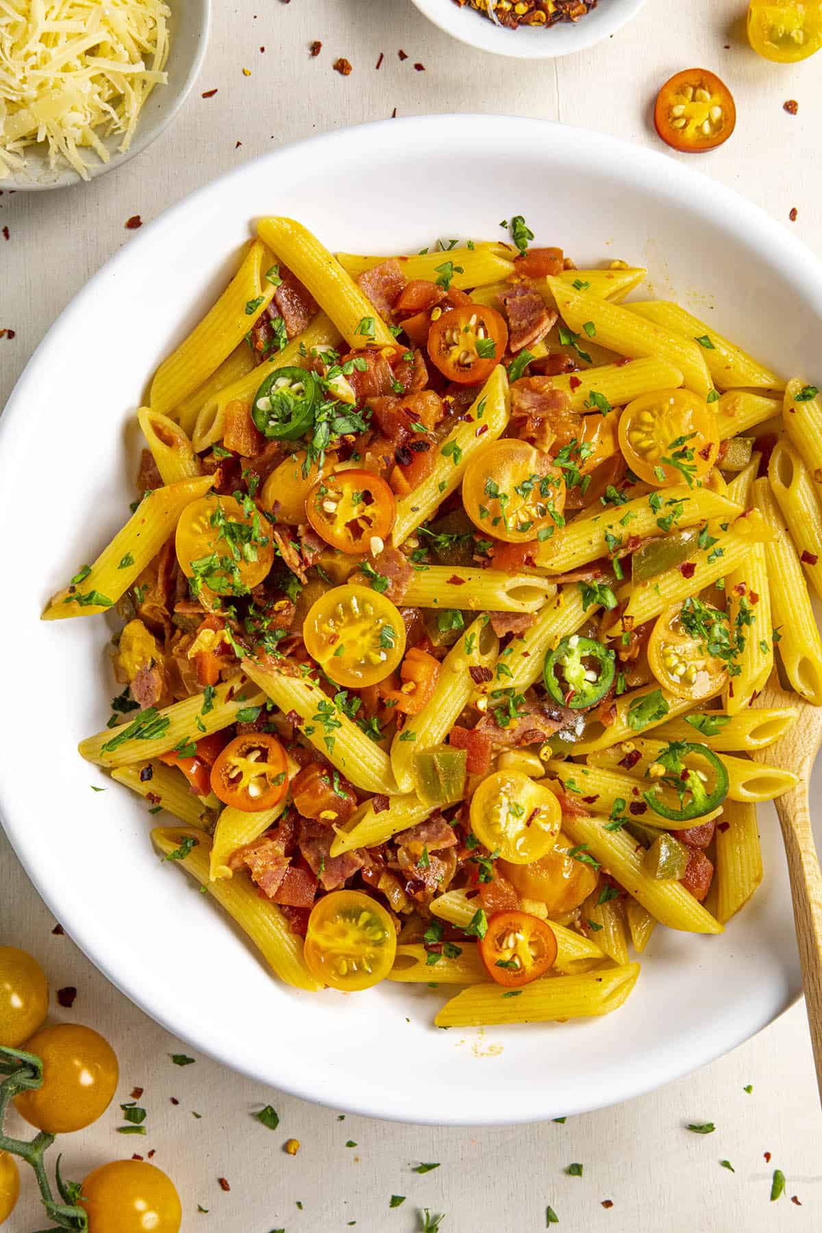 Penne Arrabbiata in a bowl with extra spicy chili flakes