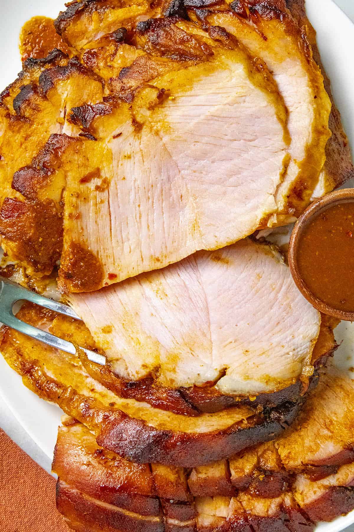 Sliced Chipotle-Honey Glazed ham on a plate