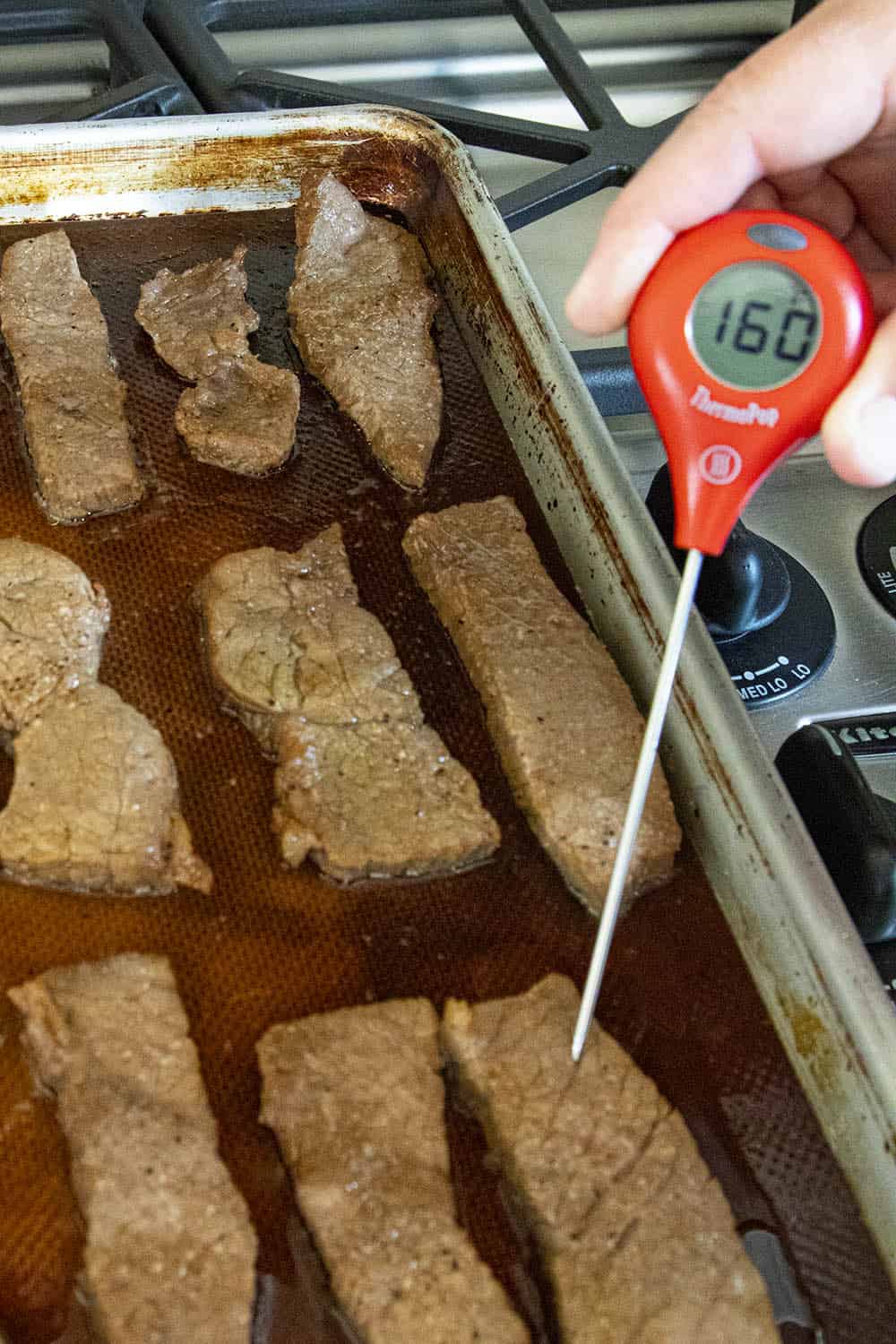 Checking the temperature of my cooked beef - 160 degrees F.