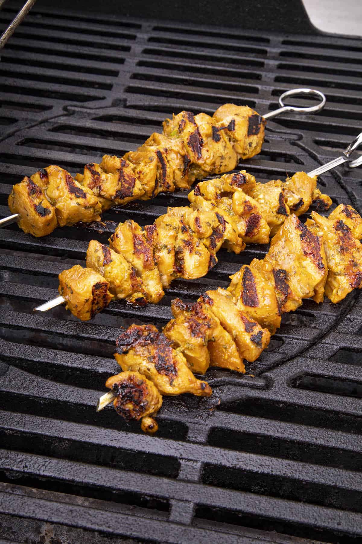 Chicken satay skewers on the grill