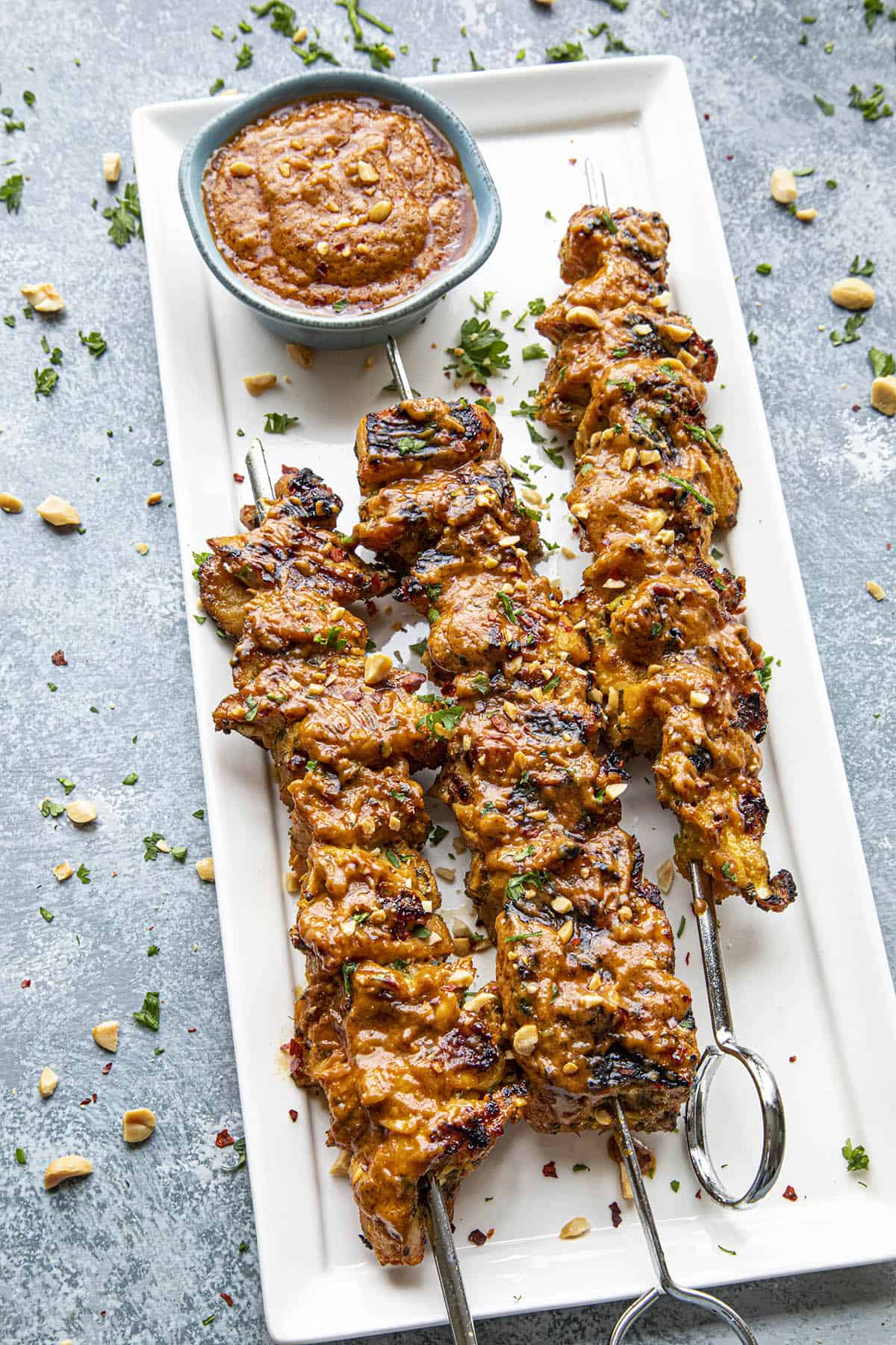 Thai Chicken Satay skewers on a plate, ready to serve