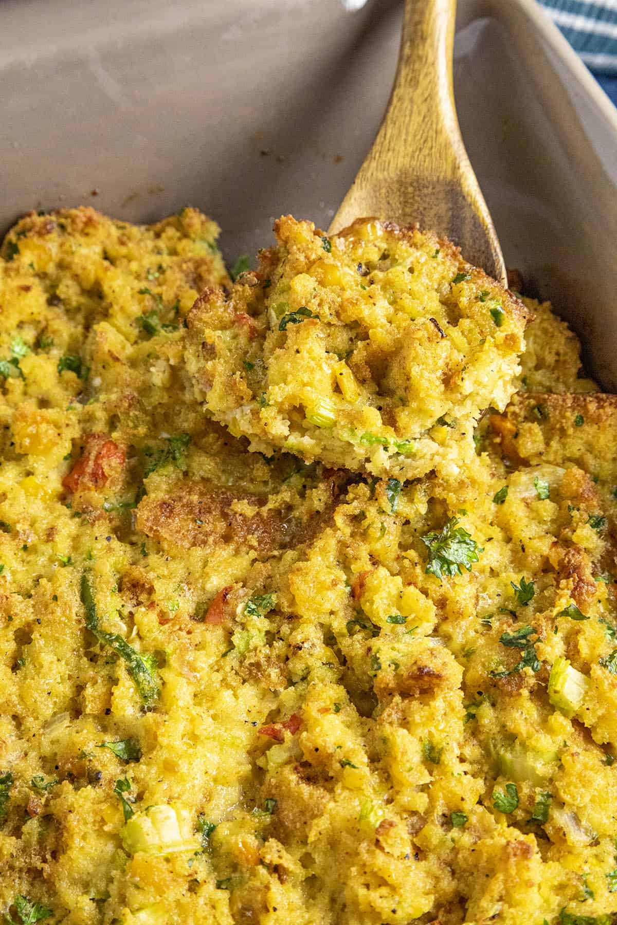 Cornbread Dressing being served on a spoon