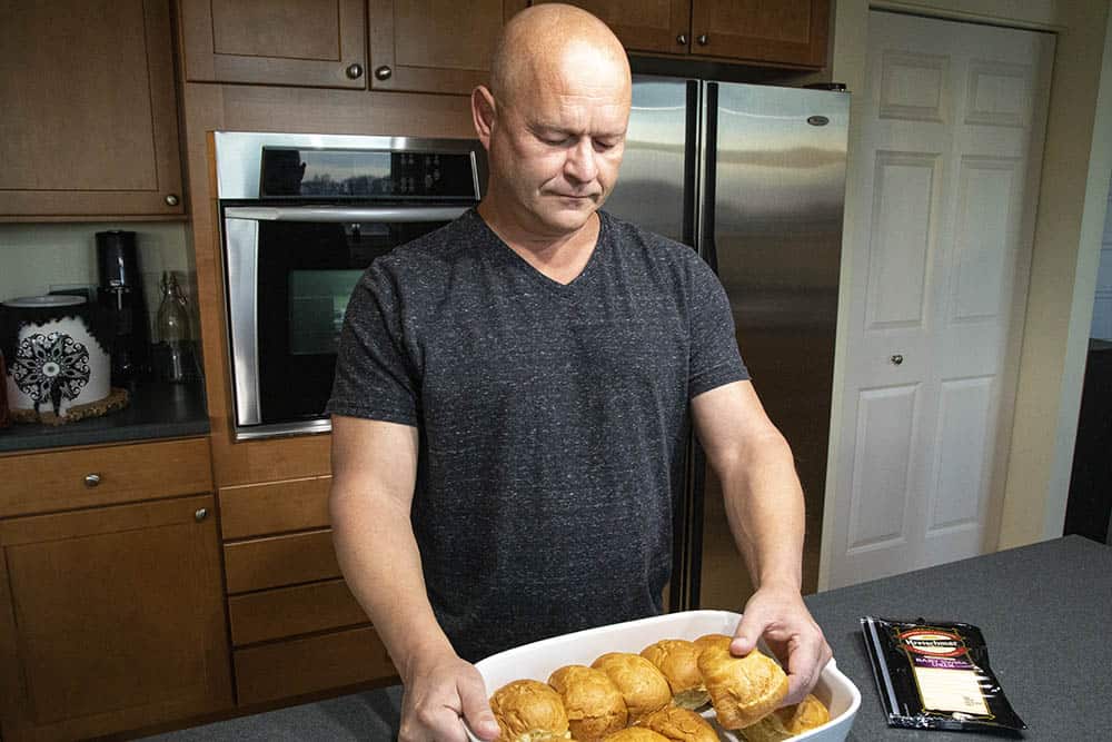 Mike making Spicy Crack Ham and Cheese Sliders.