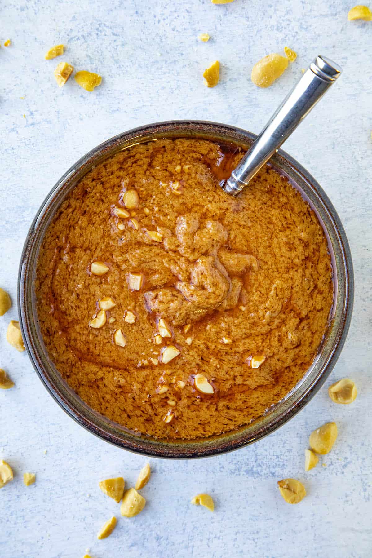 Easy Thai Peanut Sauce in a bowl with a serving spoon