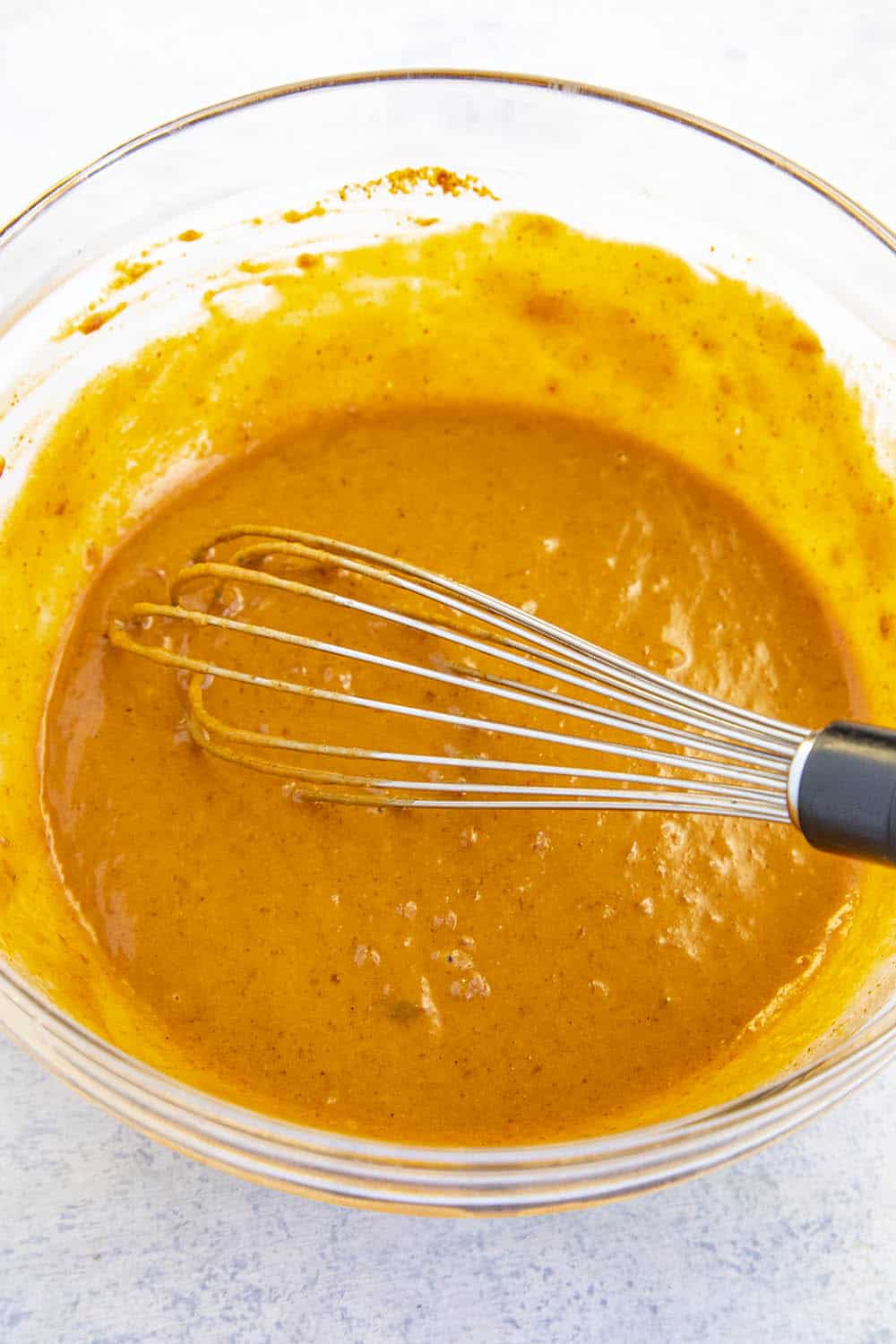 Easy Thai Peanut Sauce whisked together in a bowl.