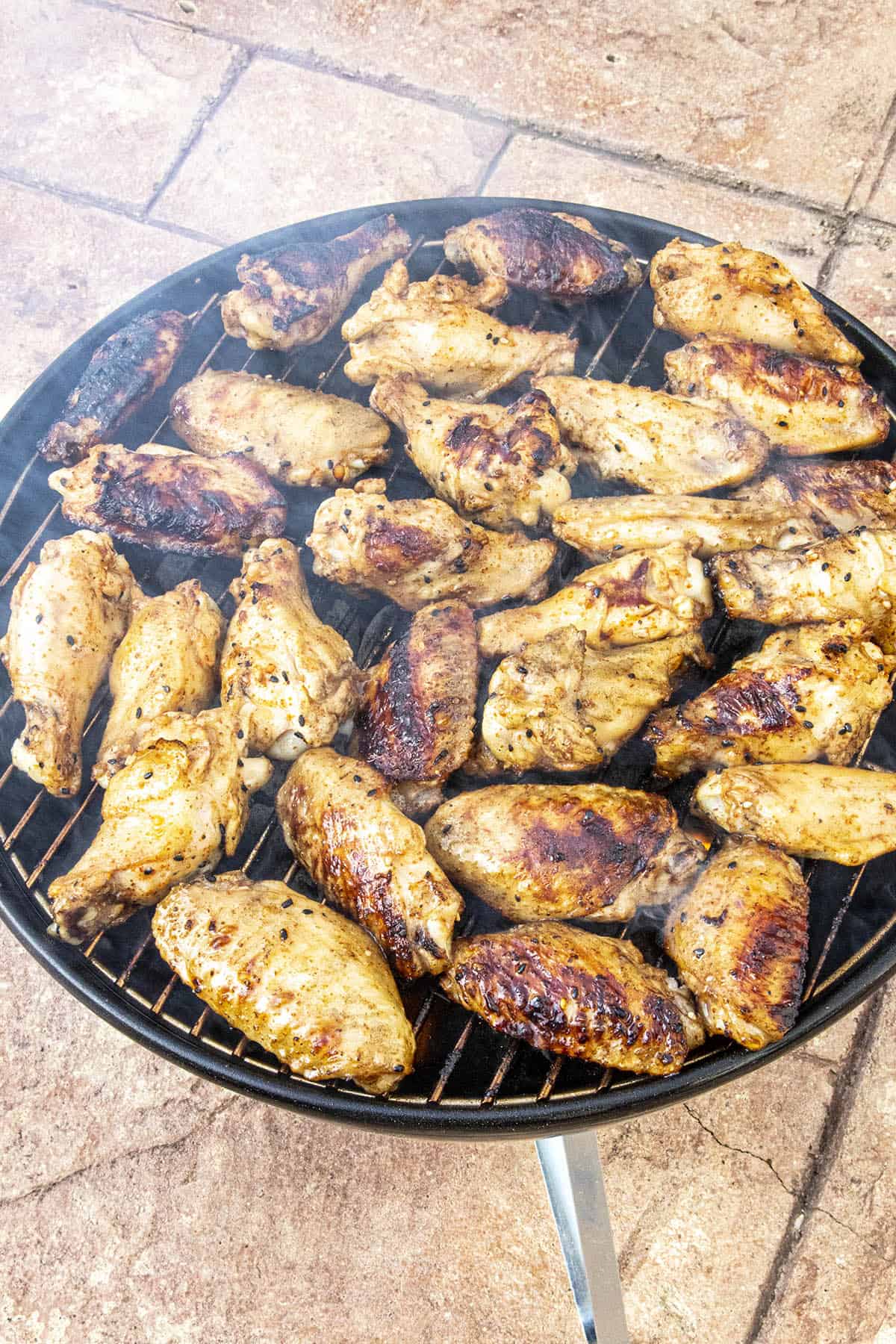 Grilled chicken on the grill, nice and smoky.