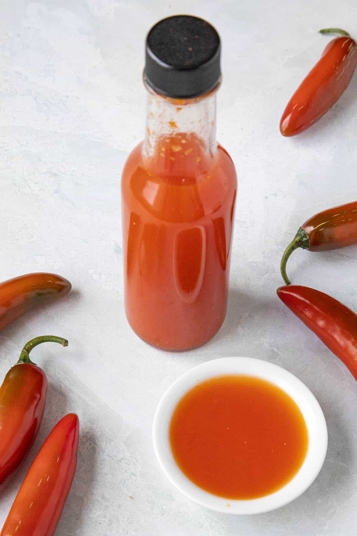 A bottle of Red Serrano Hot Sauce