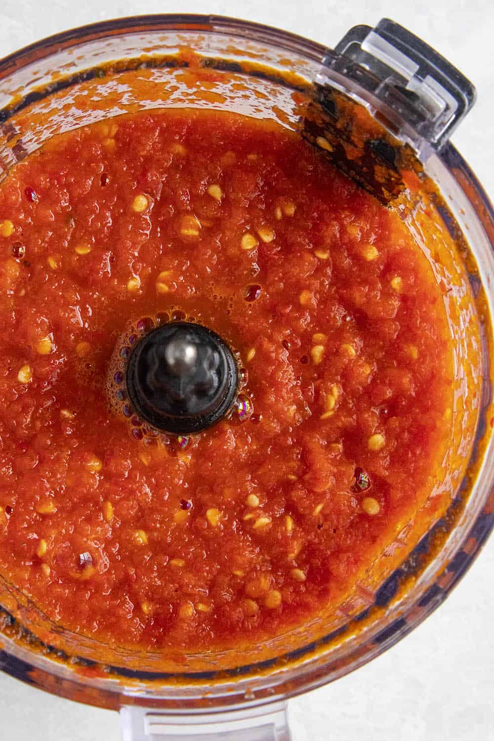Red Serrano Hot Sauce processed in a food processor
