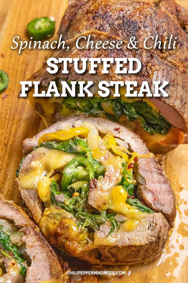 Spinach, Cheese and Chili Stuffed Flank Steak - This stuffed flank steak recipe is packed with loads of spinach, melty cheese and a mix of peppers for a nice level of spice. Stuff, sear, bake! Easy! #FlankSteak #HolidayMeal #Dinner