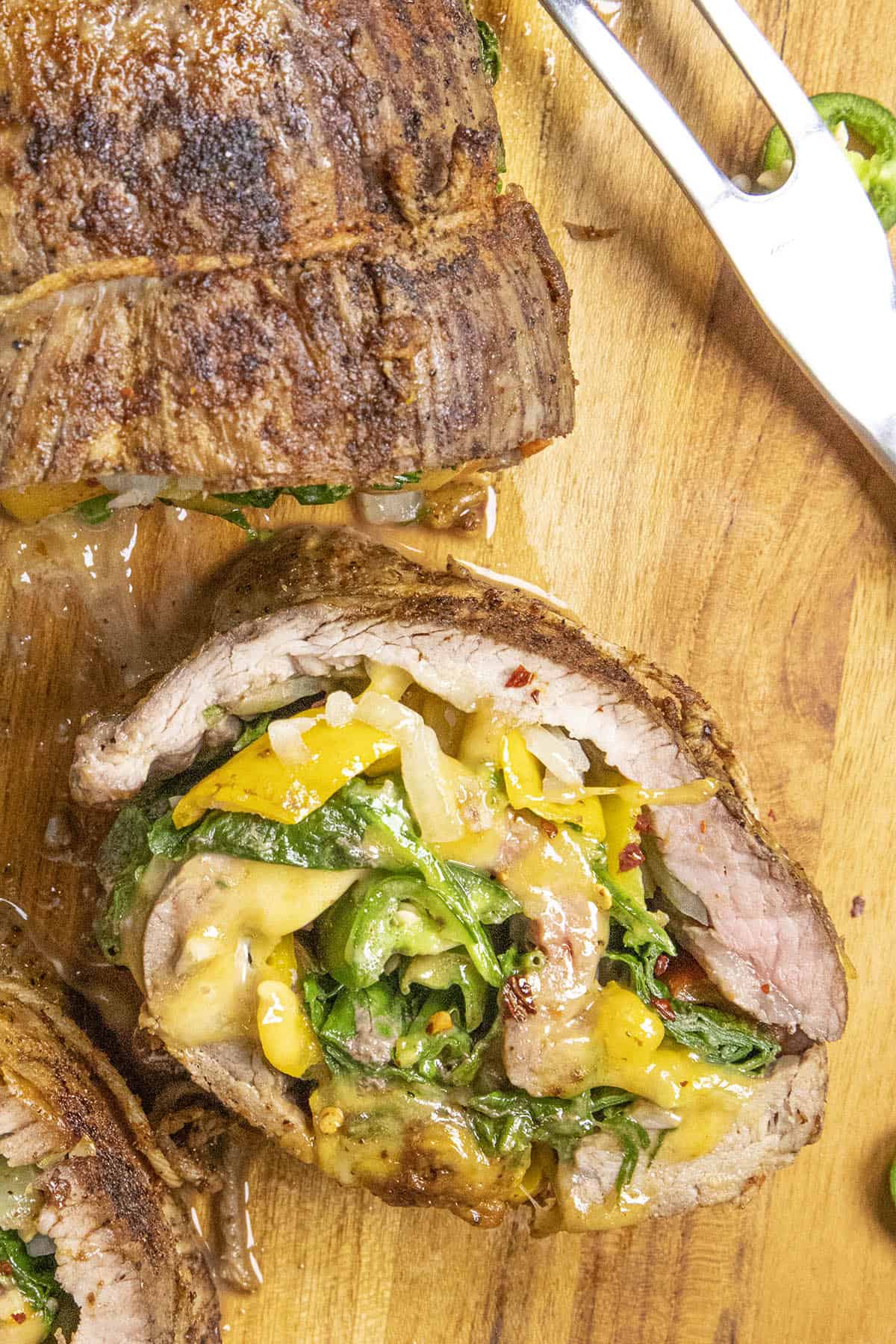 Spinach, Cheese and Chili Stuffed Flank Steak ready to serve