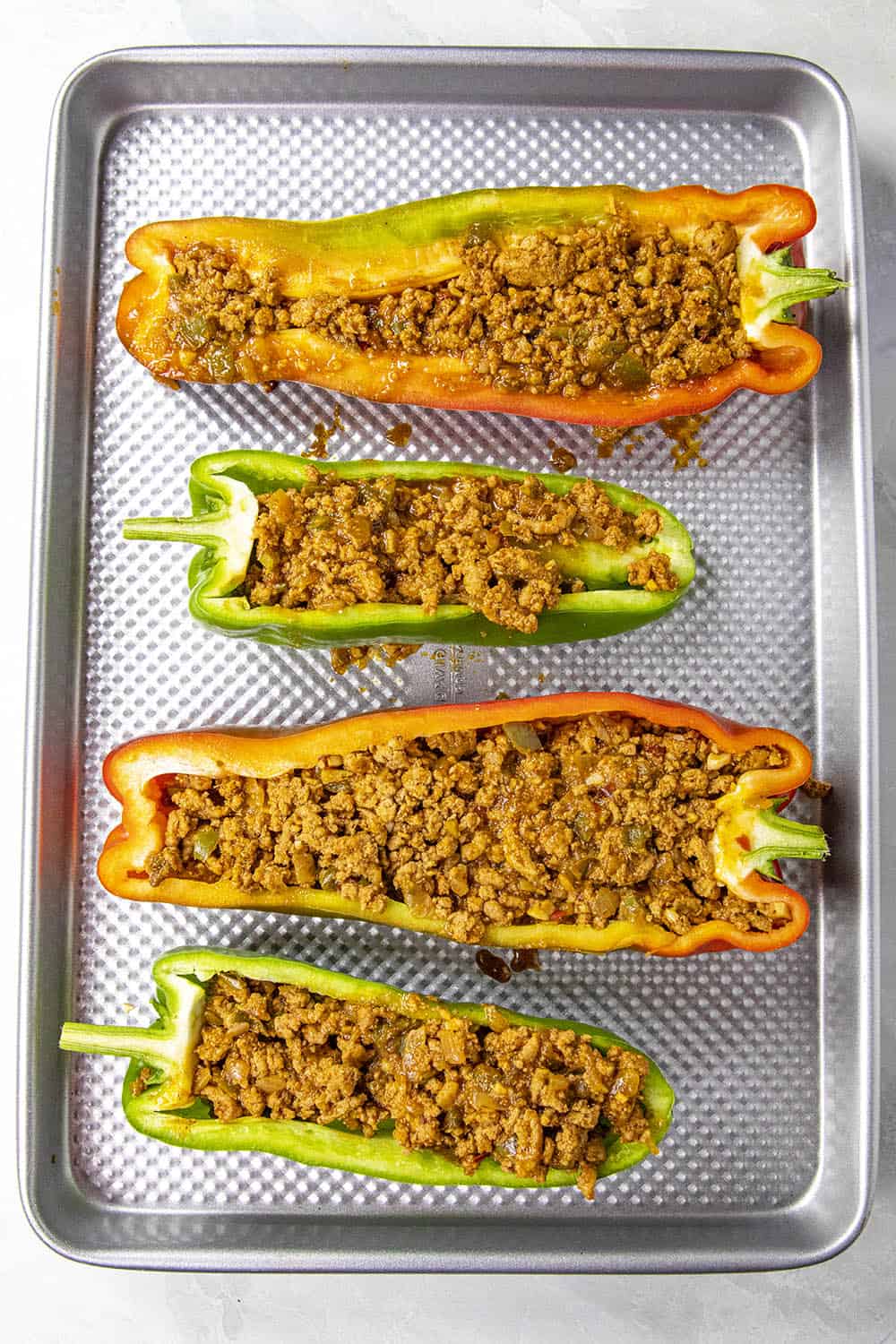 The sliced peppers stuffed with ground taco meat