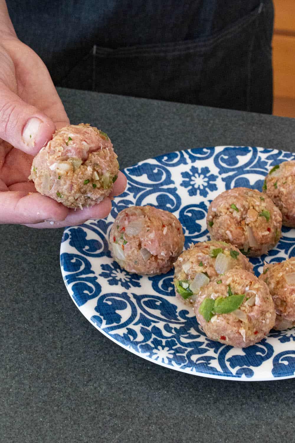 Rolling the turkey meatballs.