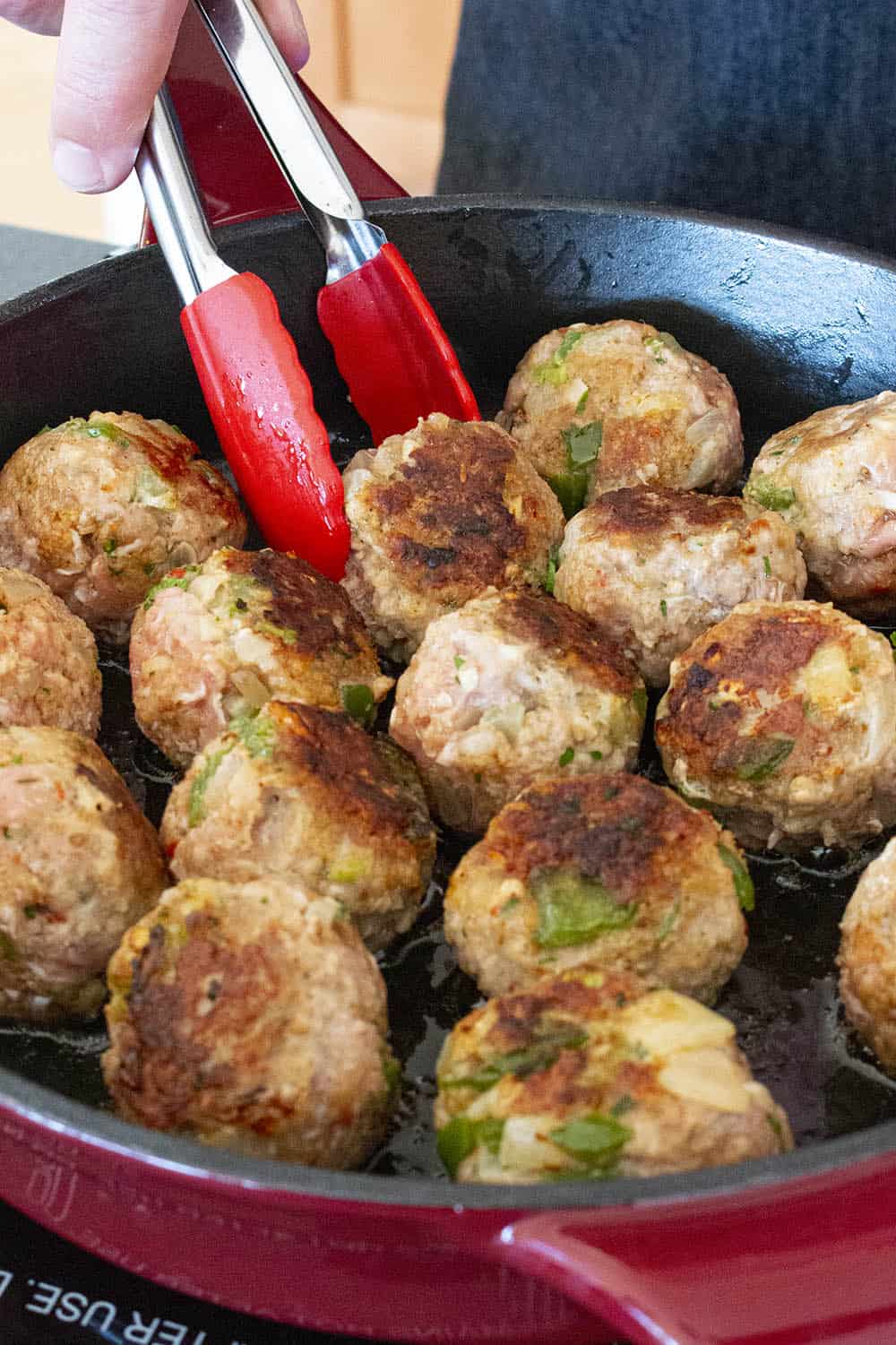 Browning the Turkey Meatballs in a hot pan.