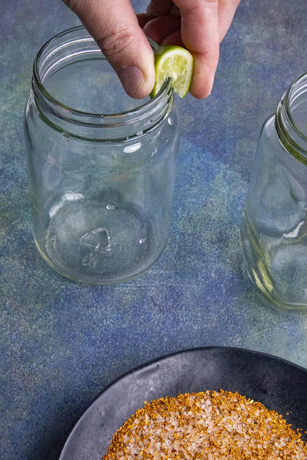 Wetting the rim on my Michelada glass with fresh lime juice