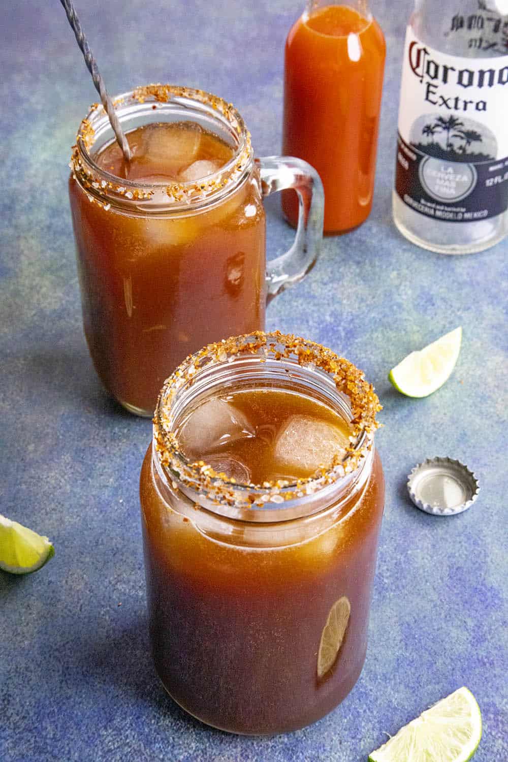 Two micheladas, Mexican beer and Clamato juice cocktails, ready to enjoy
