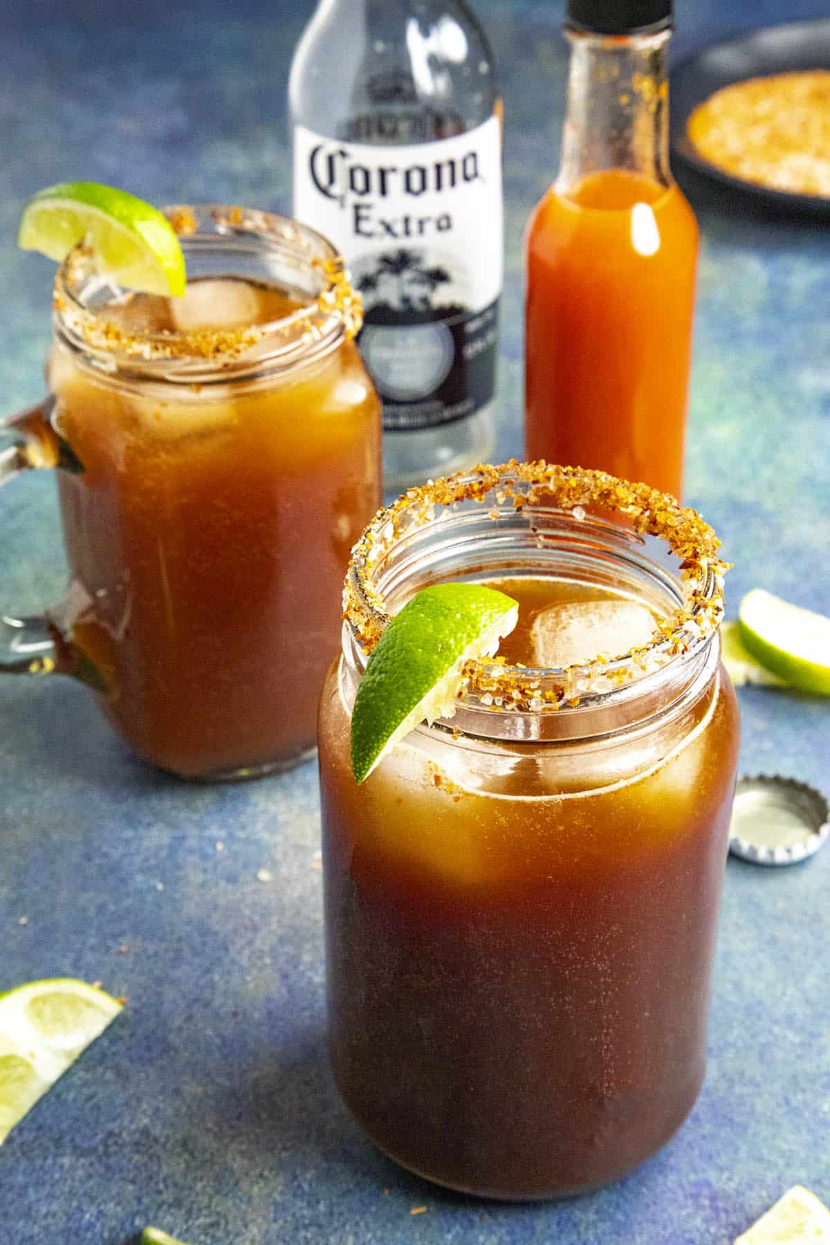Two micheladas, Mexican beer and Clamato juice cocktails, ready to enjoy