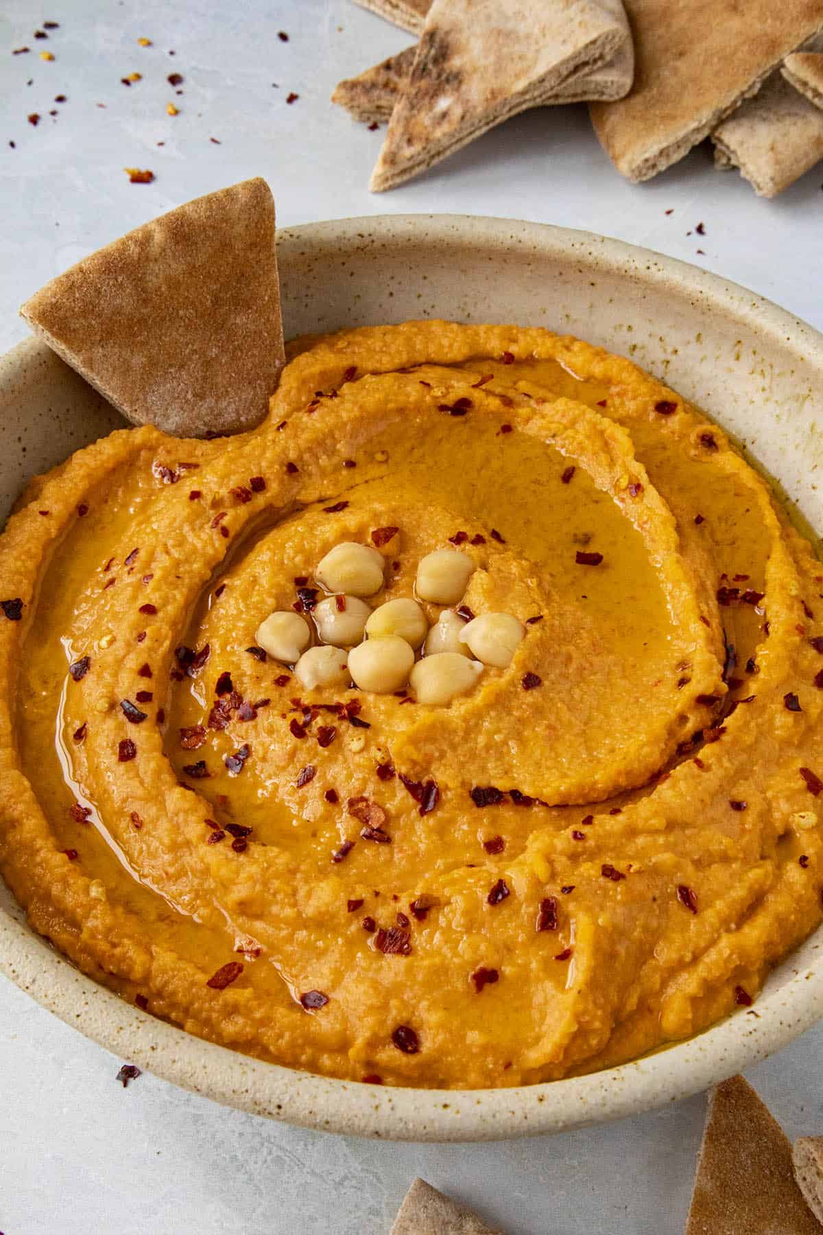 Creamy Roasted Red Pepper Hummus in a bowl, ready to serve