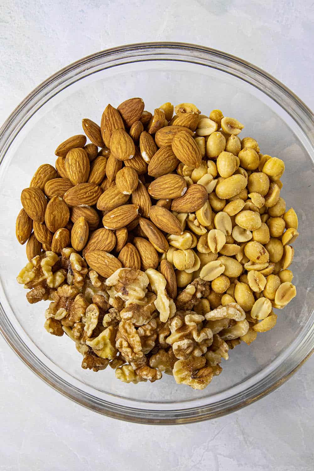 Raw pecans, almonds and peanuts for making spiced nuts
