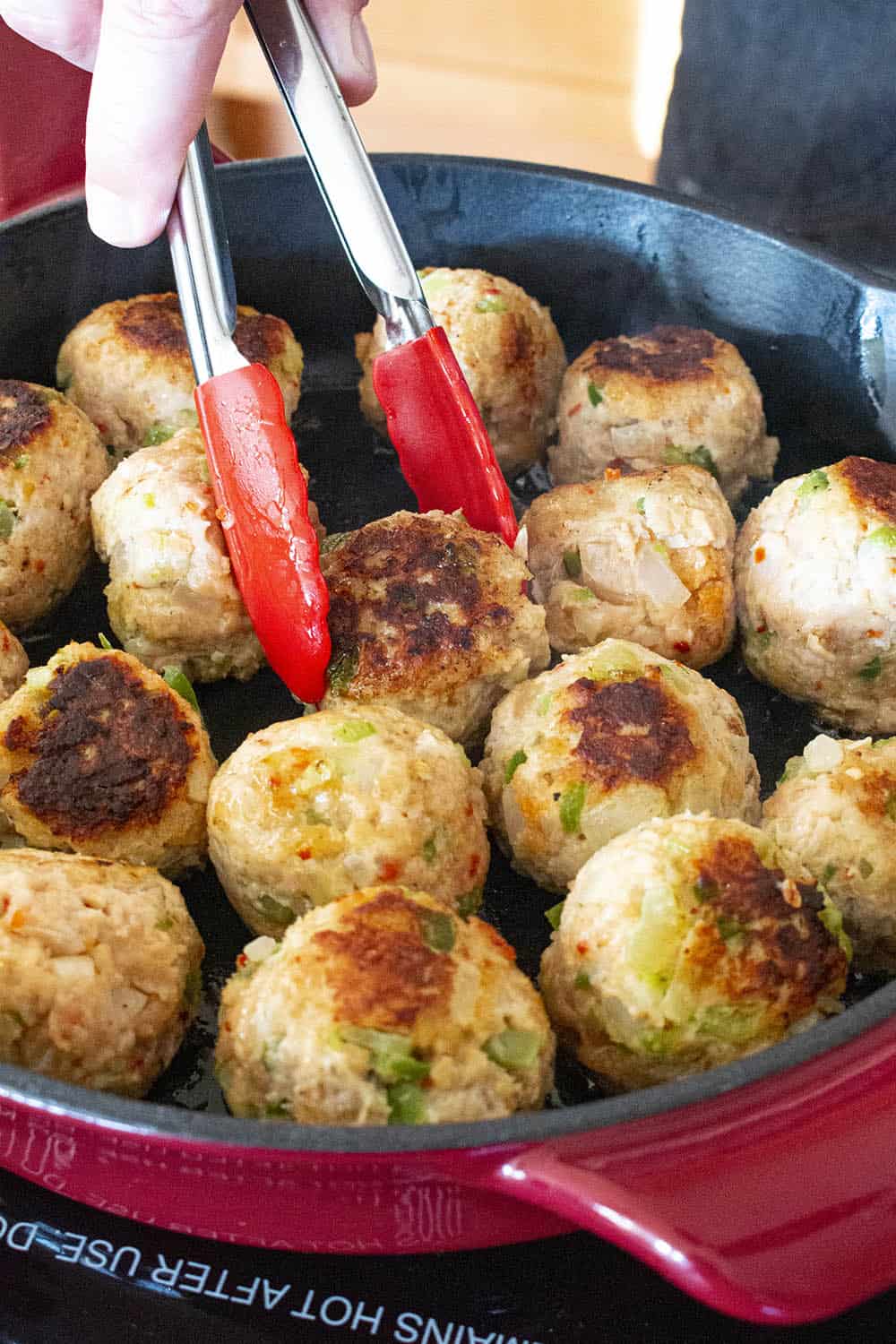 Searing off my chicken meatballs in a pan