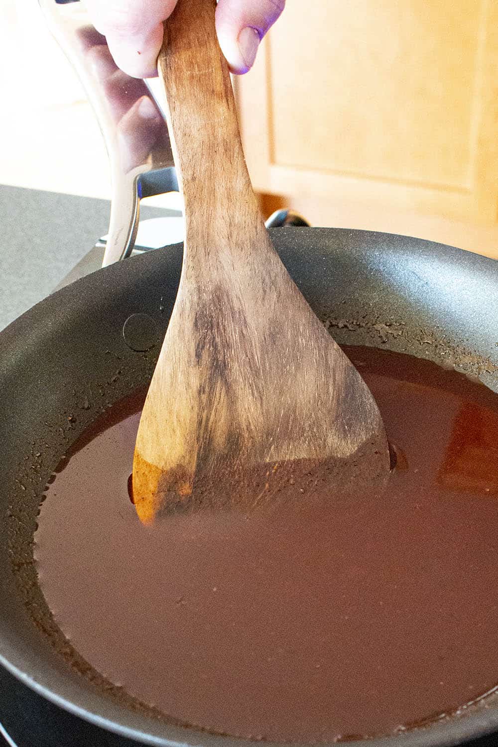Spicy Korean gochujang glaze in a pan, ready for the meatballs