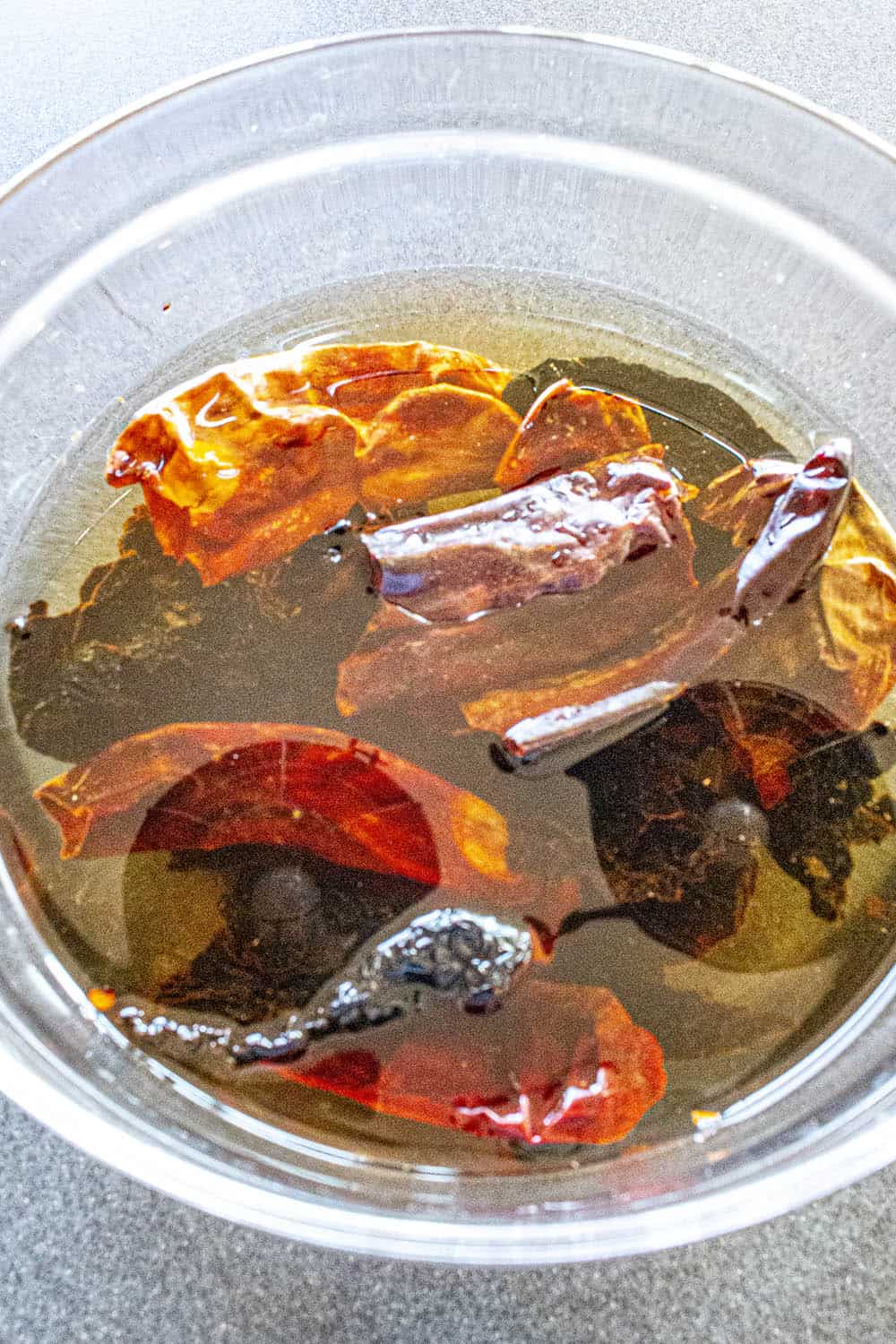 Soaking the peppers to make adobo sauce