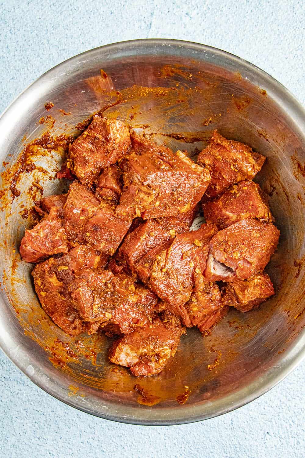 Chunks of seasoned meat in a bowl