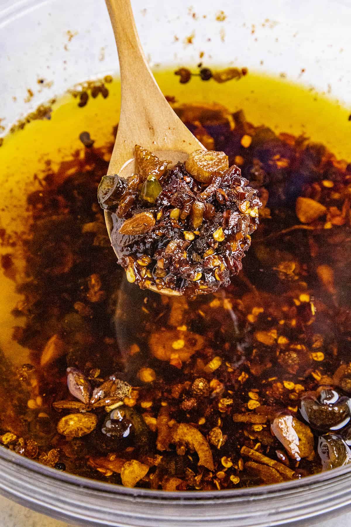 The texture of the chili crisp crispy bits on a spoon