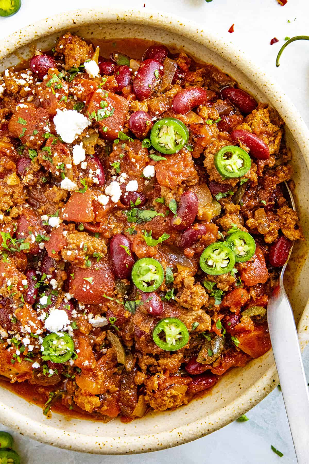 Spicy Chipotle Chili in a bowl with a spoon, ready to serve