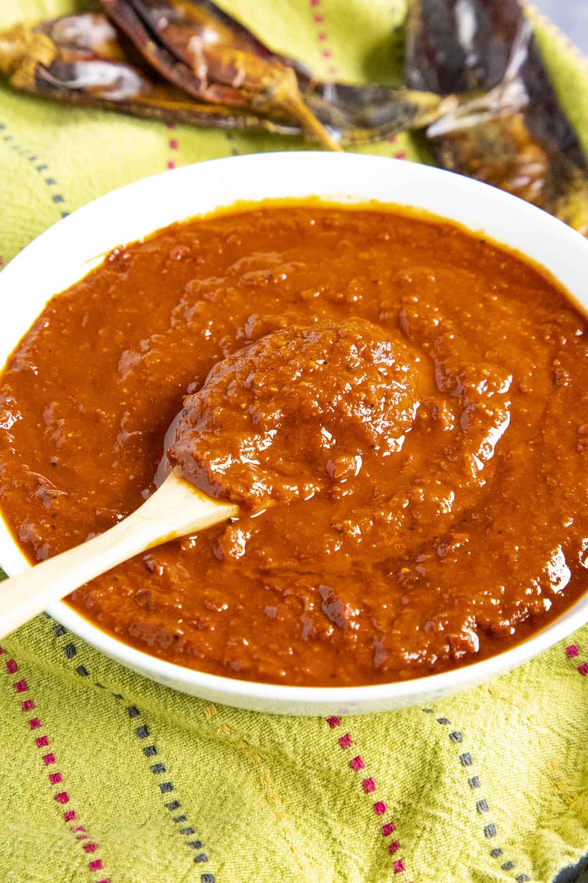 Homemade guajillo sauce on a spoon