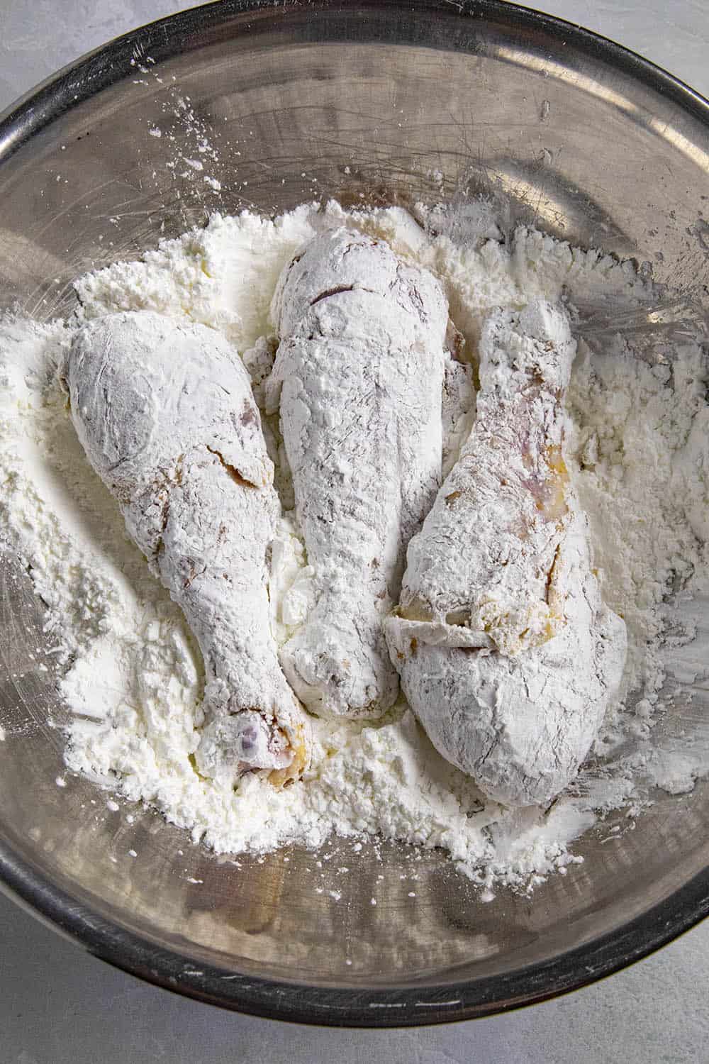 Coating the chicken with corn starch