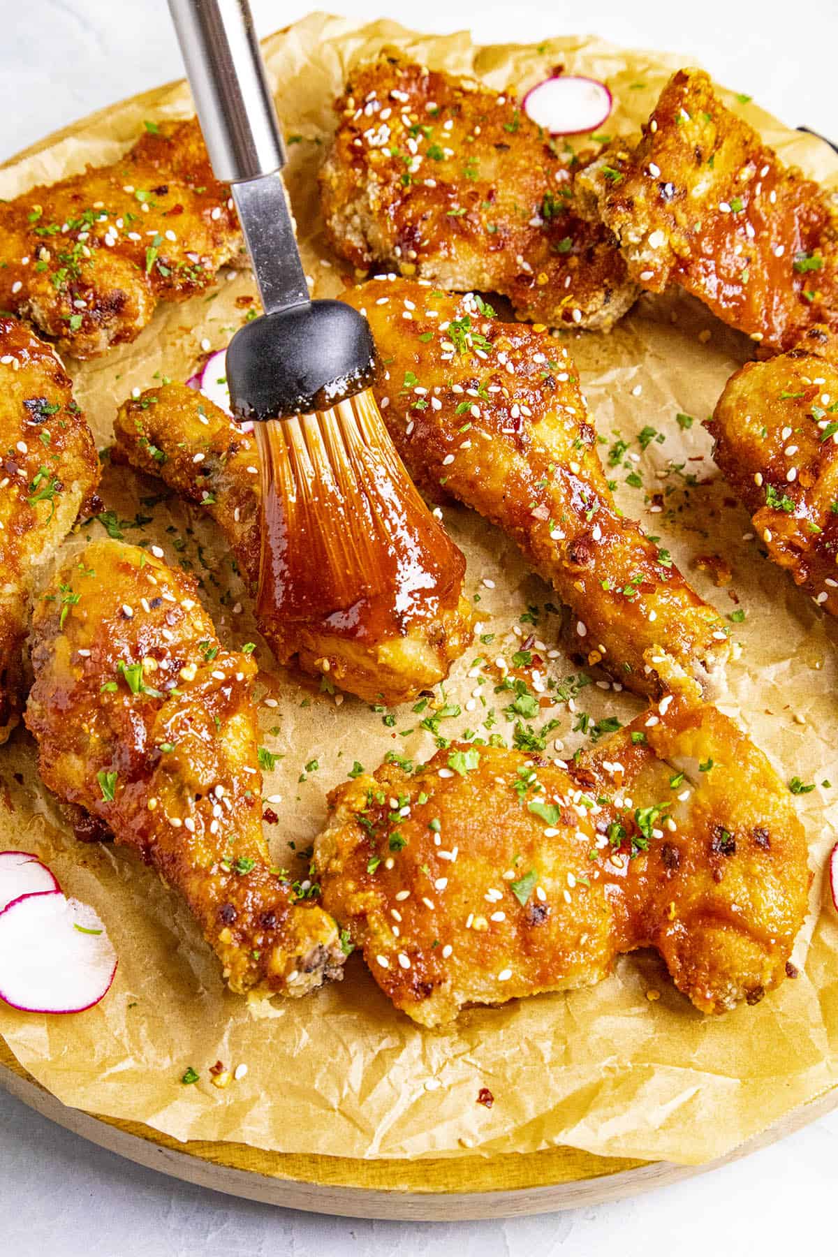 Brushing the sauce onto the Korean Fried Chicken