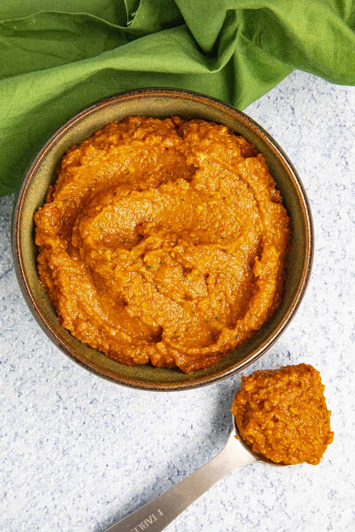 A bowl full of thick and spicy Red Curry Paste