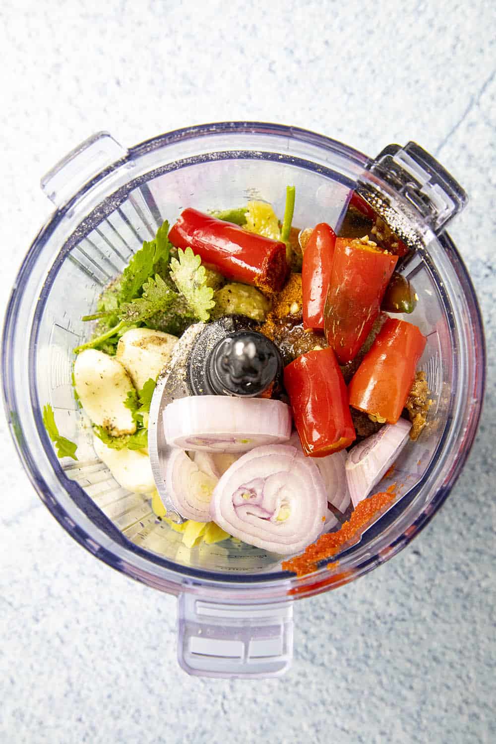 The ingredients in a blender to make Thai red curry paste