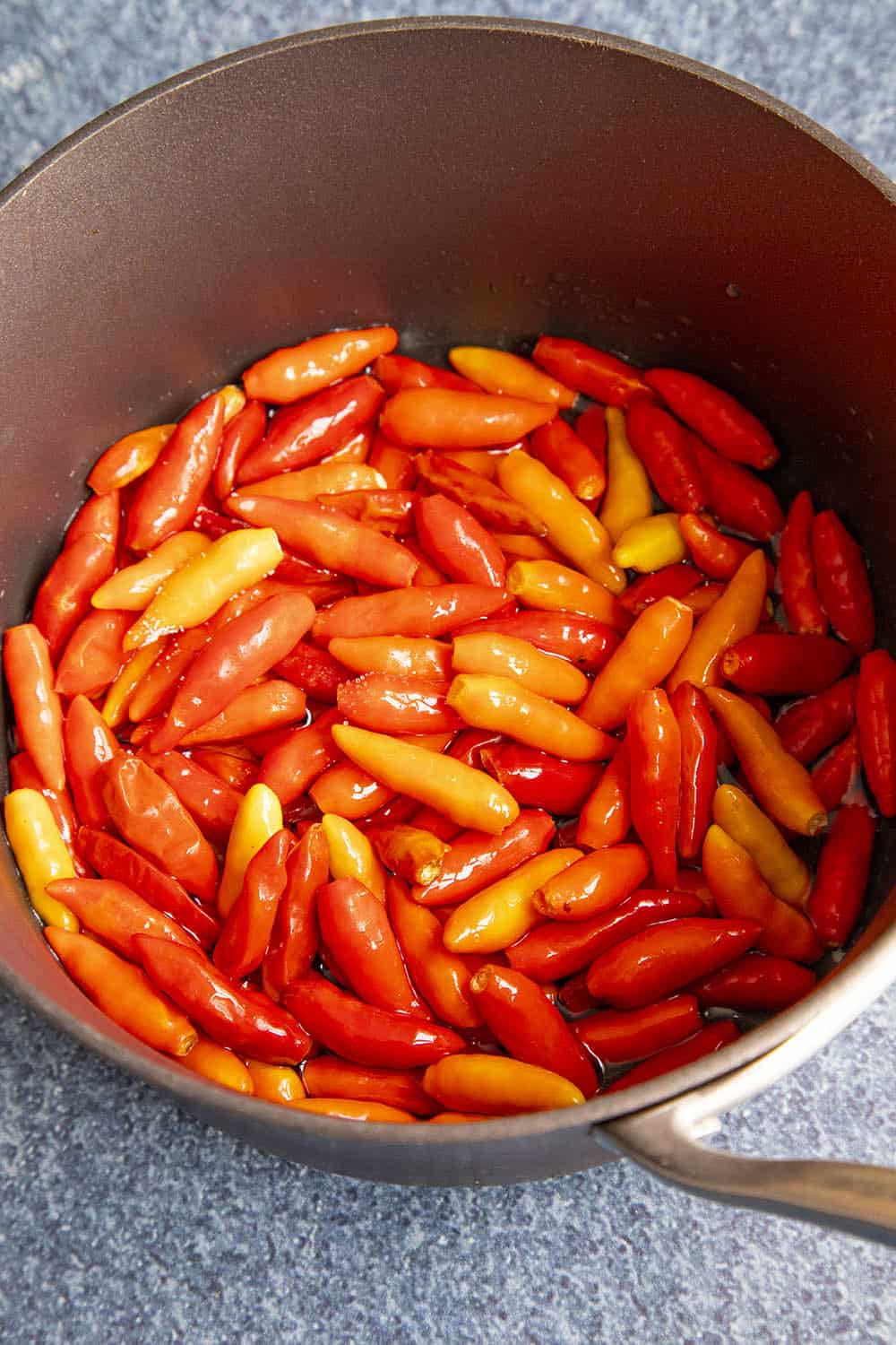 Cooking down tabasco peppers to make hot sauce