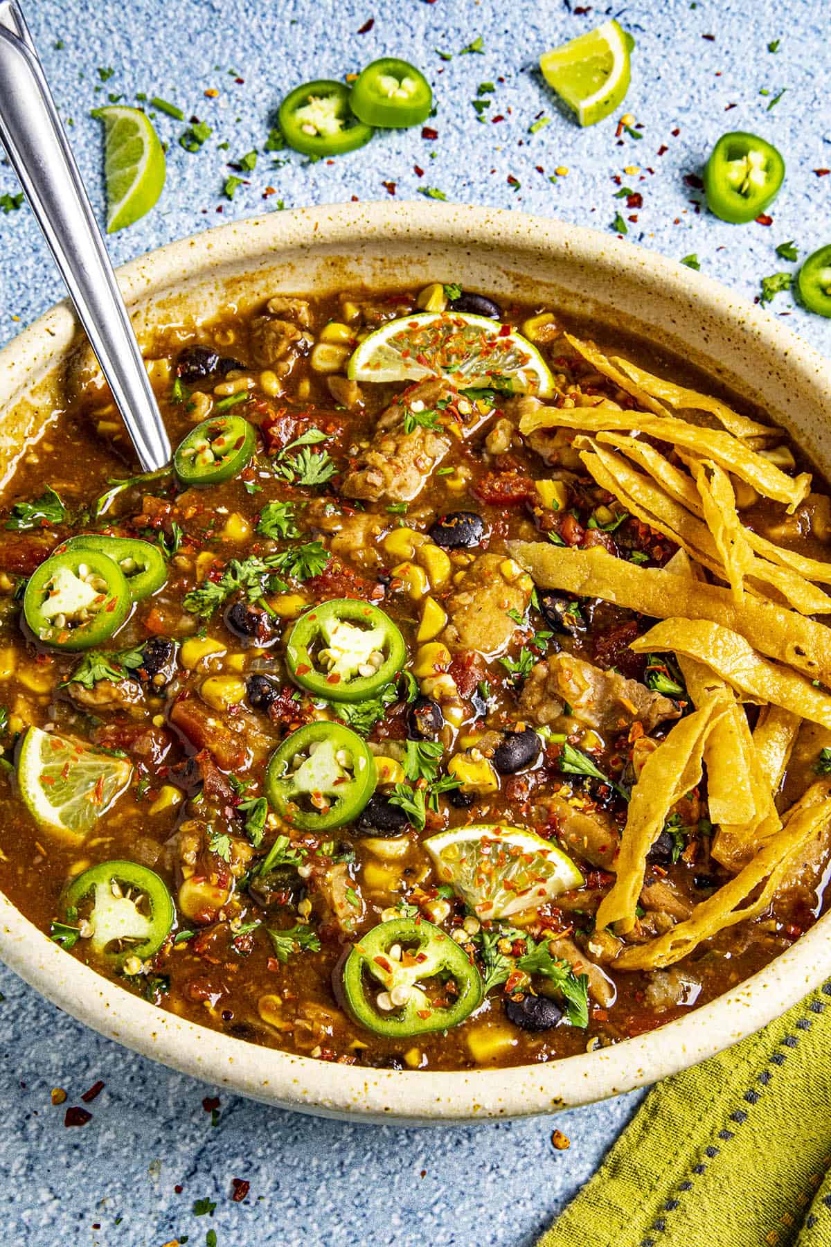 Chunky Chicken Tortilla Soup in a bowl with a spoon