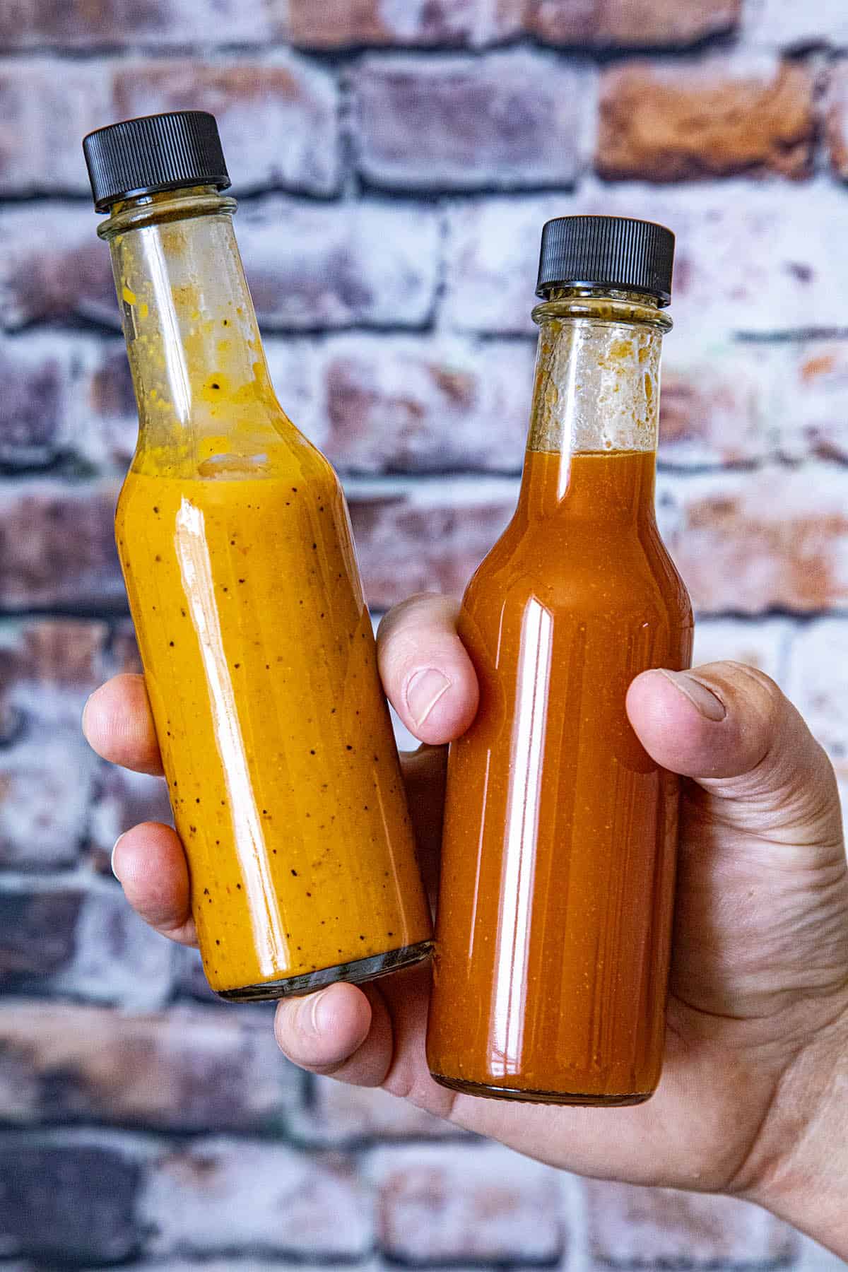2 bottles of hot sauce, both made from dried chili peppers