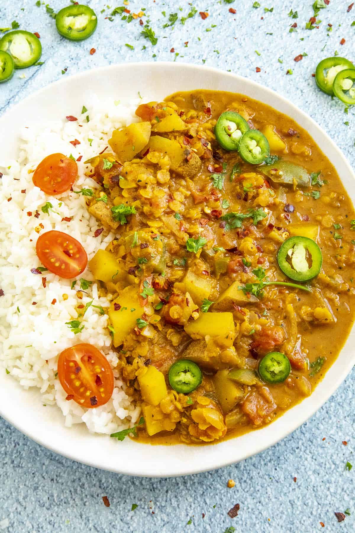 Masoor Dal (Red Lentil Curry) in a bowl with lots of garnish