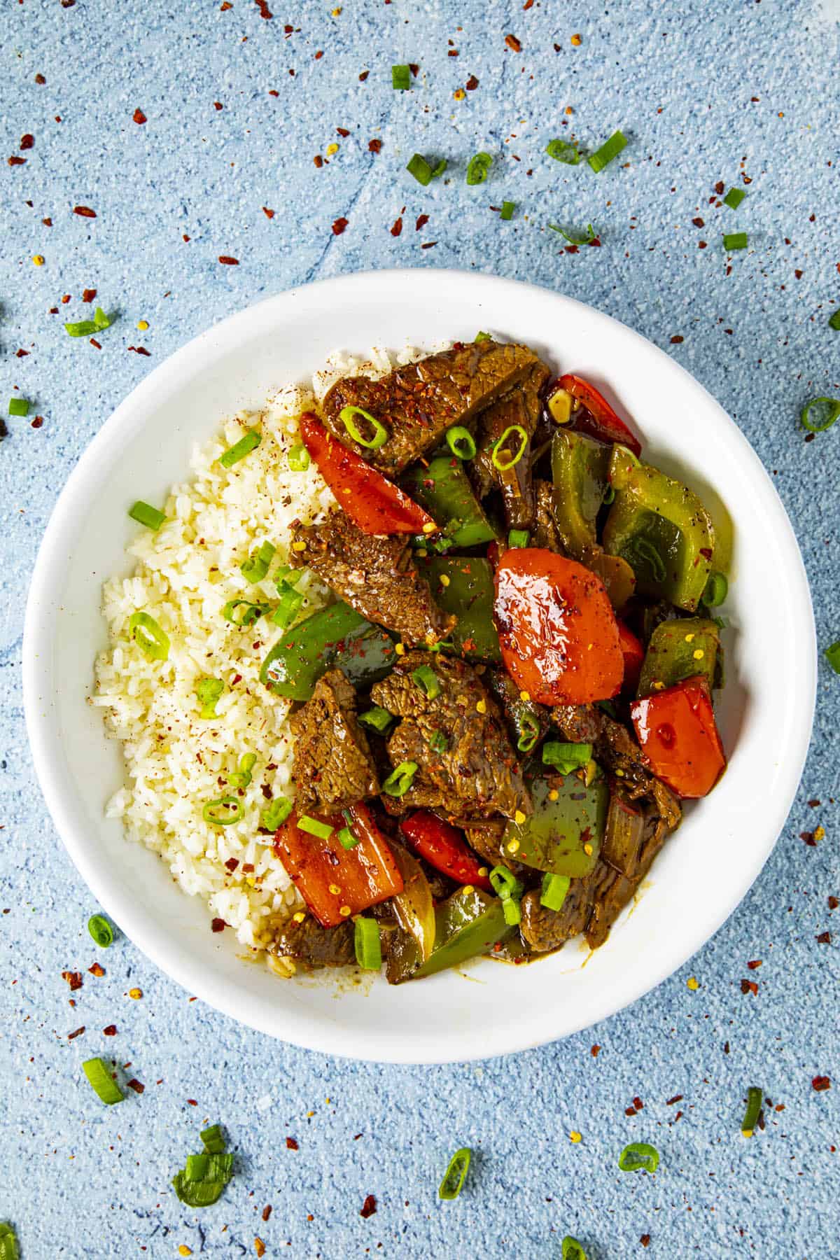 Pepper Steak in a bowl over rice, ready to serve