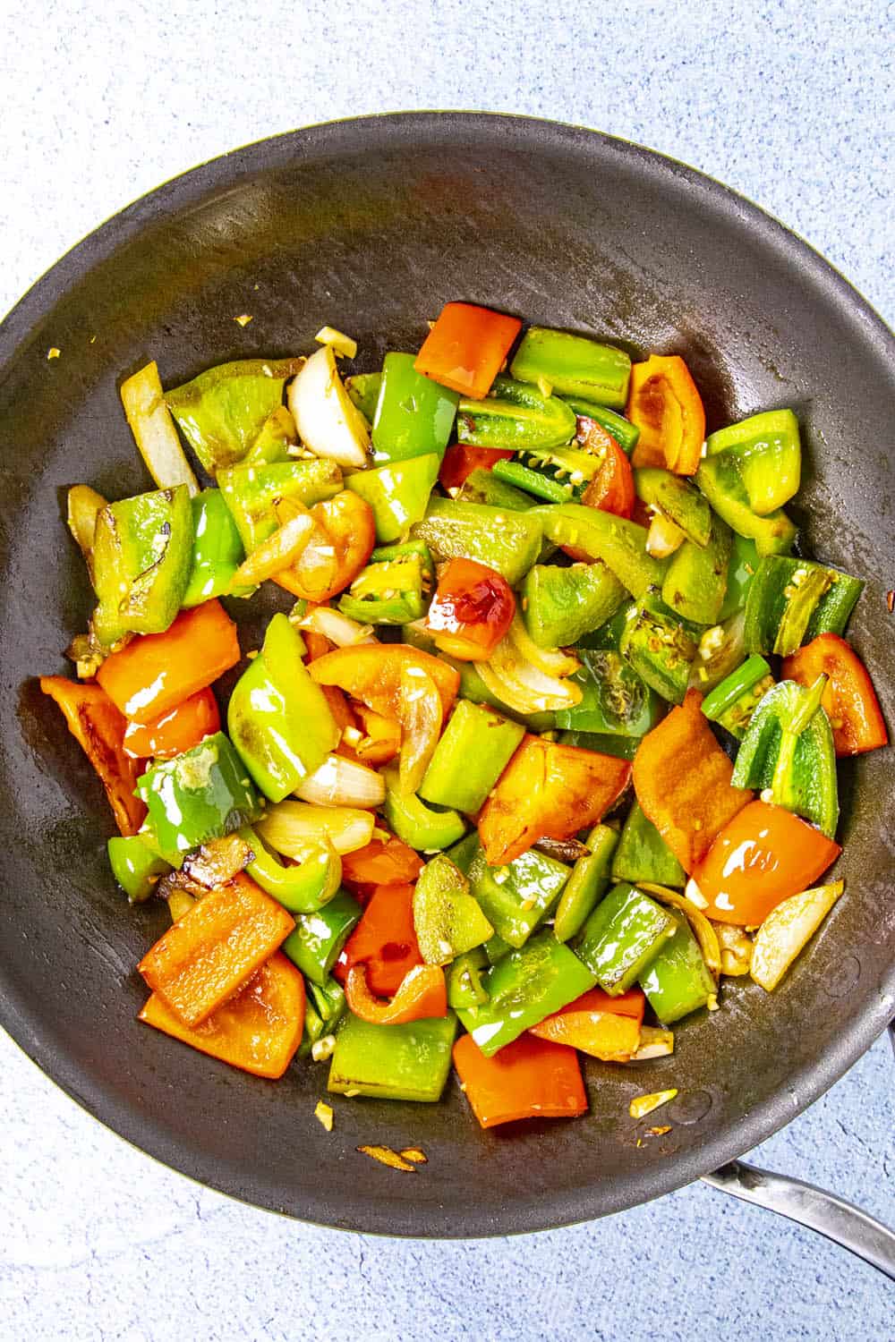 Cooking the peppers in a hot pan