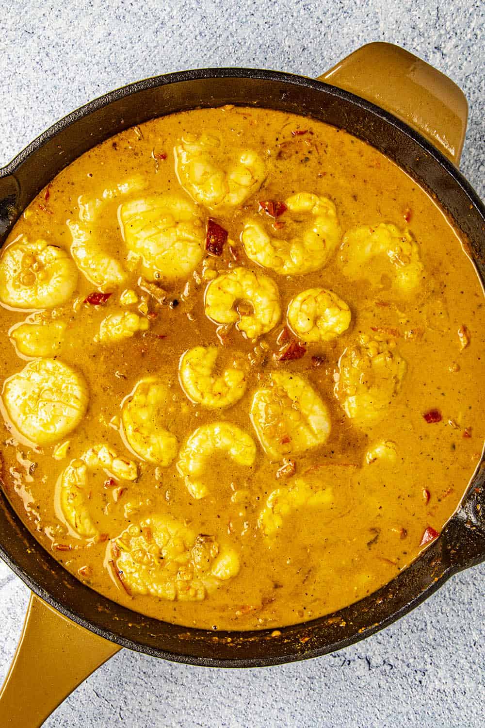 Adding the shrimp to the simmering red curry.